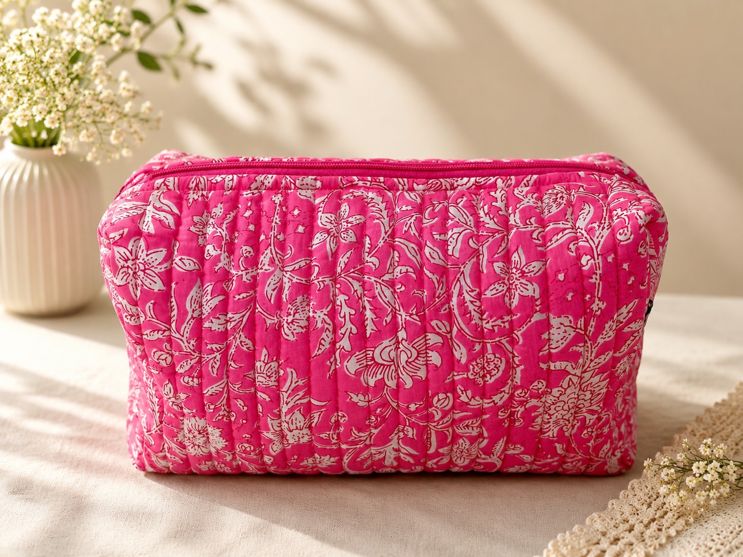Pink floral quilted cosmetic pouch