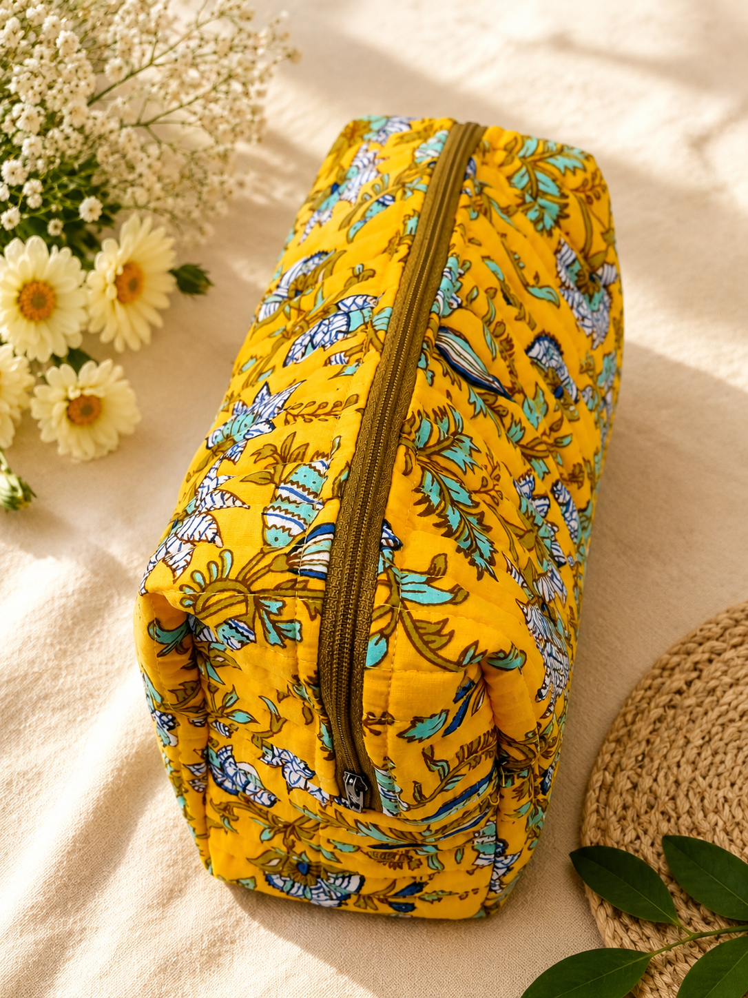 Yellow floral quilted cosmetic pouch